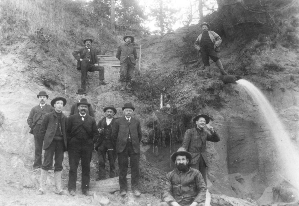 historical image of crews working to repair a broken water pipeline